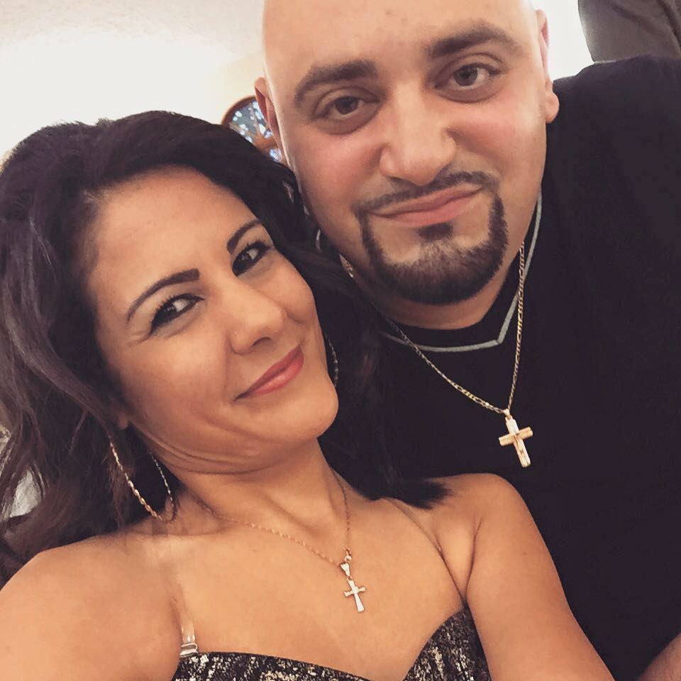 Mike Obeid and his wife enjoy company together. Obeid is happy to be back at Centennial.