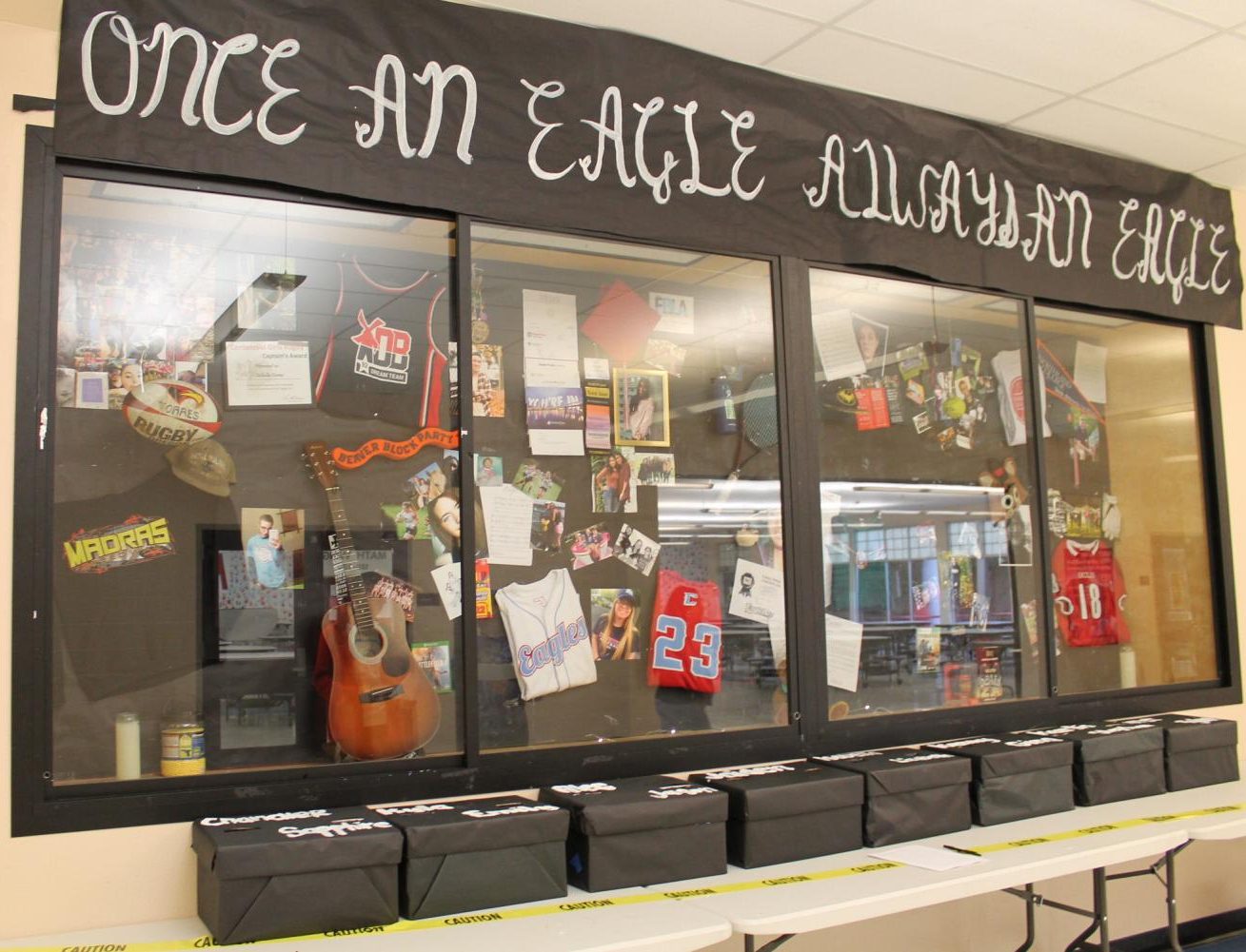 The EFM boxes with pictures outside the commons. Here students can write notes to peers participation in the event.