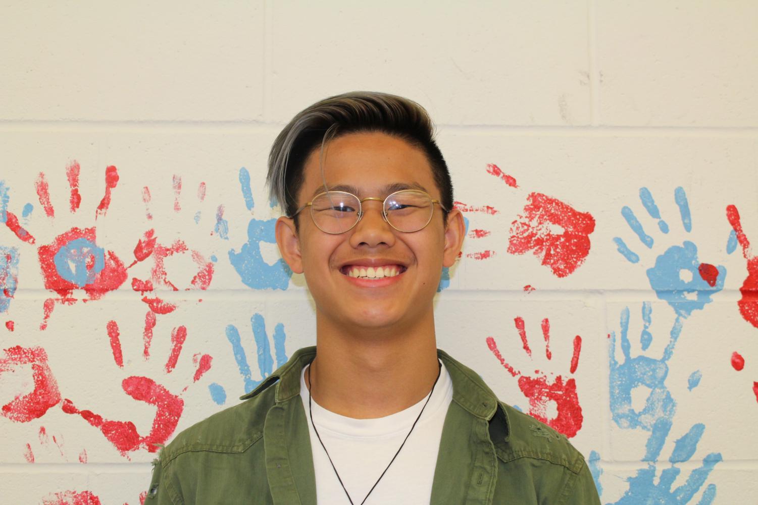 Austin Peng hangs out by the hand wall. Peng discussed his views on the walkout that occurred.