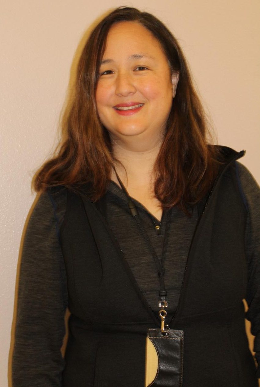Jen Loeung stands outside her classroom. Loeung was very proud of how the speech team performed at state.