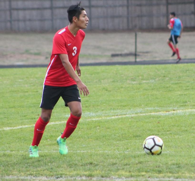 Kevin Vasquez, number 3, passes the ball across the field. The Eagles ended the season with a final score of 3-2.