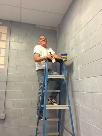 Abundant Life Church member, Phil Burke, paints auditorium.