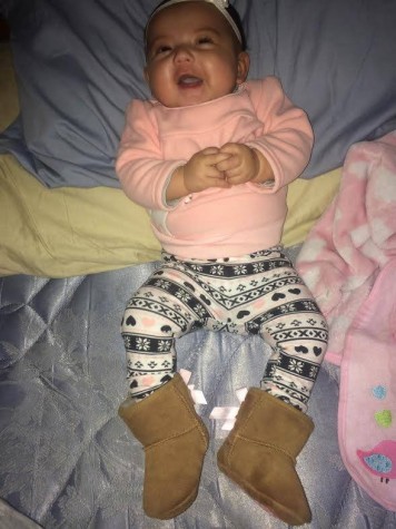 Baby Tessa, Lauren's little girl enjoying her new Uggs! 