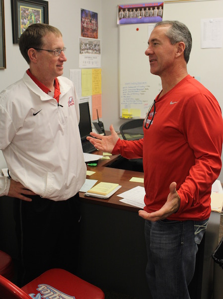 Football Coach Chris Knudsen and Athletic Director Brent Child meet earlier in the year.