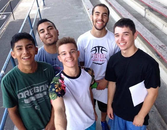 Thomas Farias, Nikkia Willingham (back row) and Felipe Rodriguez, Garrett Becker, and Ryan Payne (front row) have all joined the cheer squad.