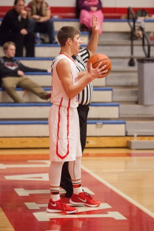 Junior Brendan Ritschard inbounds the ball