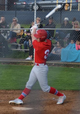 Junior Dawson Day follows through with his swing