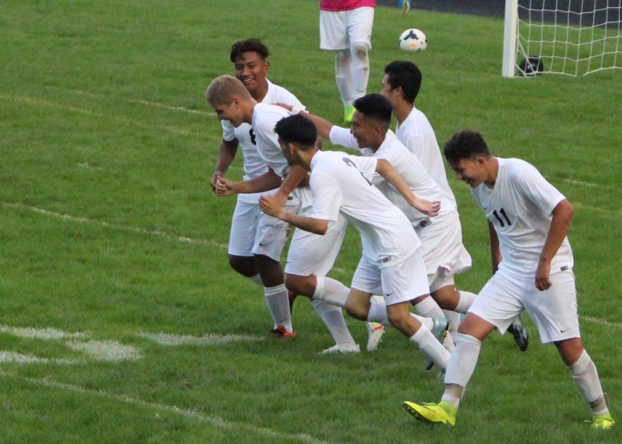 The boys team celebrates after a goal in a home game. 