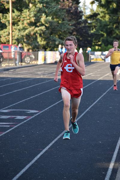 Cole Melvin sprints on the straightaway to finish his race.