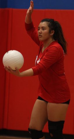 Erika Zuel serves the ball.