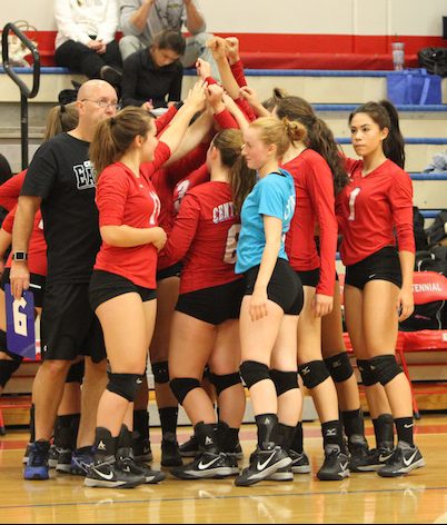 The Varsity teams breaks from the huddle after finishing the game.