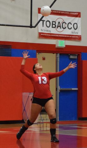 Senior Nicole Castaneda serves the ball during a home game.