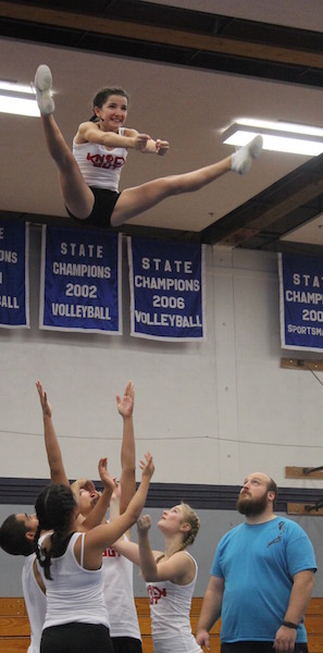 The team basket tosses sophomore Jade Wilson at Gresham competition last Saturday.