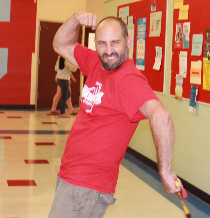 Ehren Schneider shows off his muscles in the hall, beforet he first day of school.