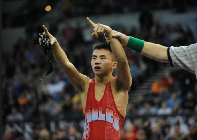 Philip Kue responds to the crowds cheers after his championship match last year.