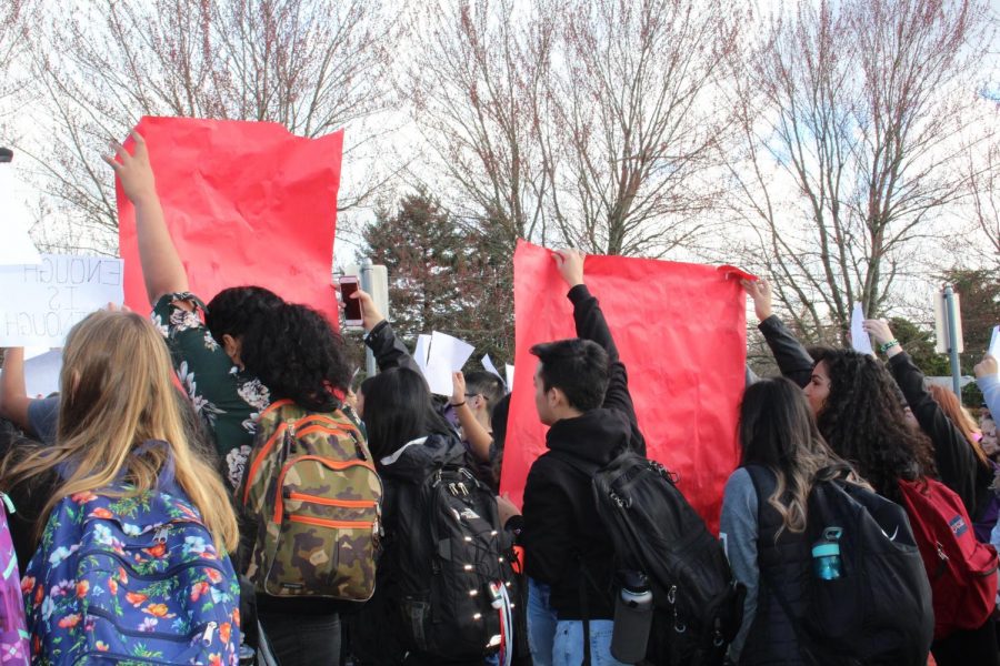 Students stand in support of the walkout. Approximately 250 students attended the event.