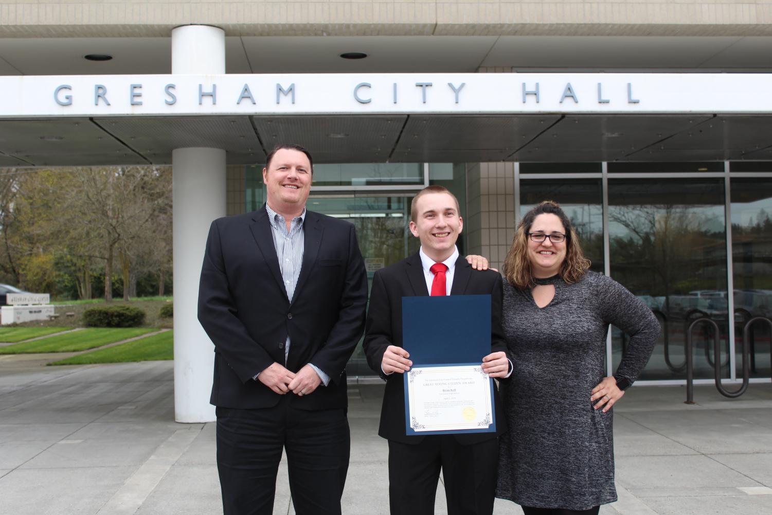 Assistant Principle Zachary Ramberg, Brian Koll and Adriann Hardin. Koll won the Young Citizen Award.