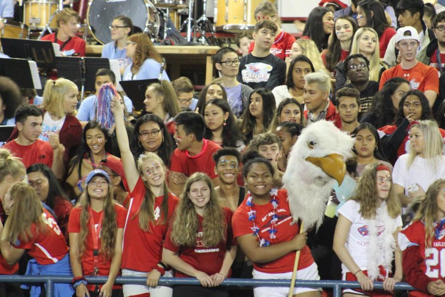 Students+cheer+in+the+stands+at+Homecoming.+The+football+team+heads+to+McMinnville+for+Fridays+game.