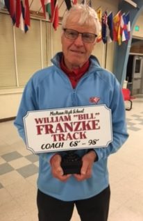 Coach Bill Franzke, the father of teacher and coach Luke Franzke, was recognized last Friday at the final track meet at Madison High School.  The facility is being remodeled, and the stadium is being torn down.