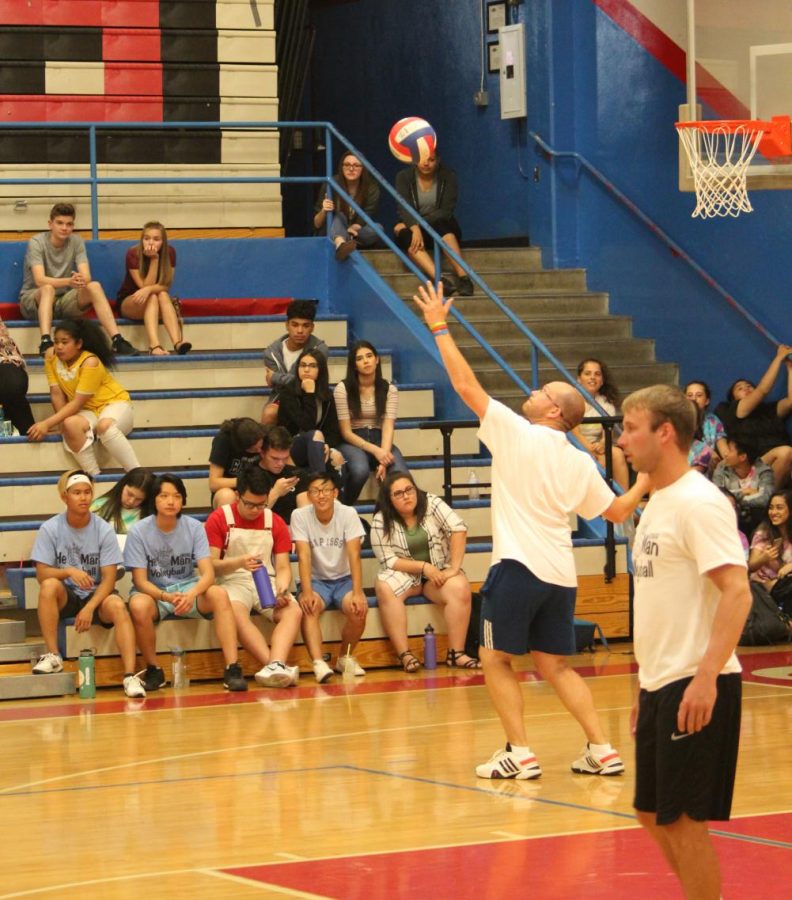 Teacher+and+Coach+Ben+Petersen+makes+a+serve+in+last+years+He-Man+Volleyball+game.